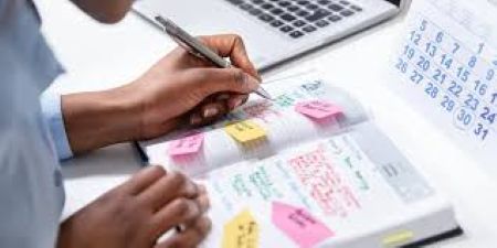 Image of person writing plans